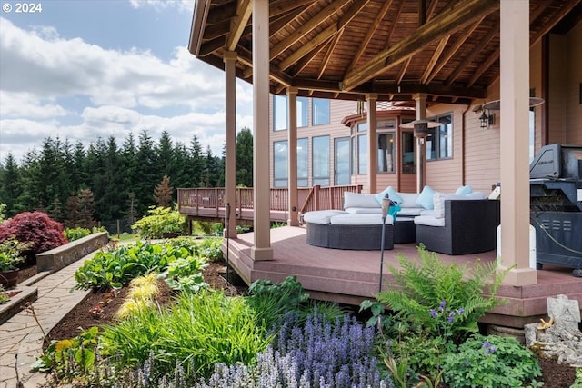 deck with an outdoor living space and a gazebo