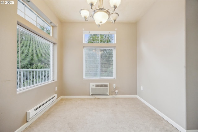 carpeted empty room featuring a wall mounted air conditioner, a wealth of natural light, a chandelier, and a baseboard radiator