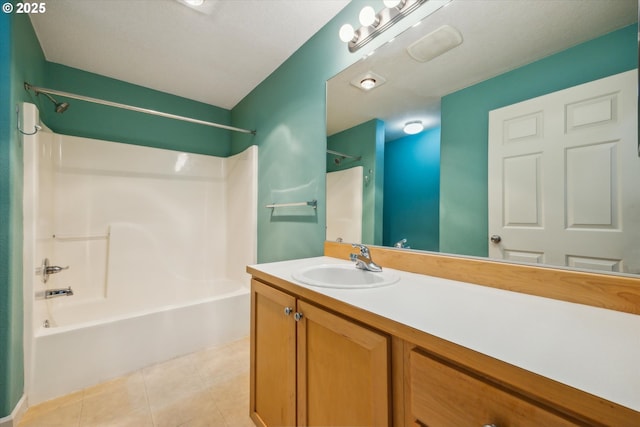 bathroom featuring vanity, tile patterned flooring, and bathtub / shower combination