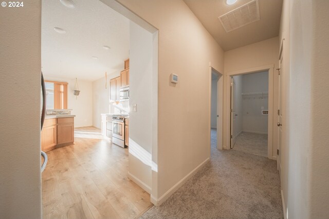 hallway featuring light wood-type flooring