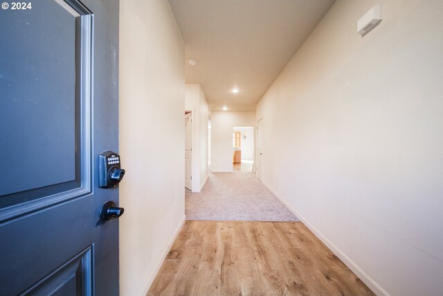 hallway featuring light hardwood / wood-style flooring