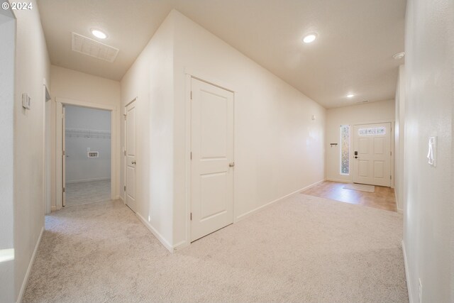 corridor with light carpet