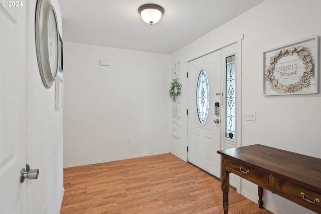 foyer with light wood-type flooring