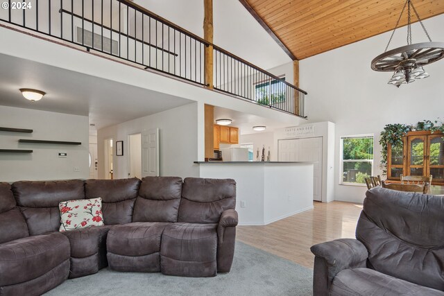 living room featuring high vaulted ceiling, wood ceiling, wood-type flooring, and ceiling fan