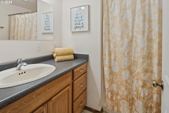 bathroom featuring vanity and walk in shower