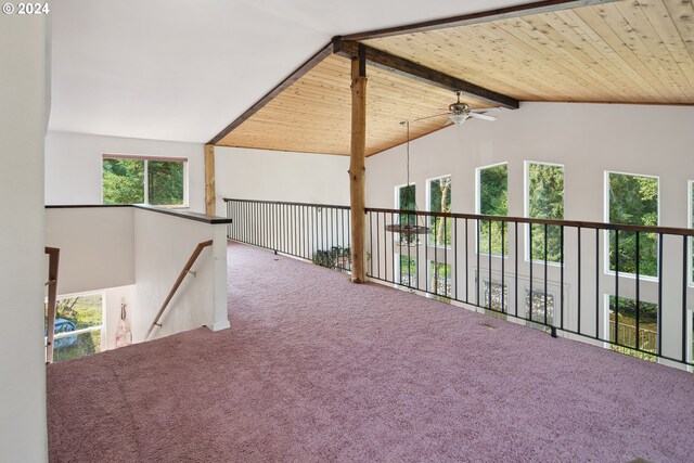 interior space with wooden ceiling, a healthy amount of sunlight, and carpet floors