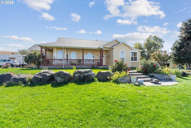 rear view of house with a yard