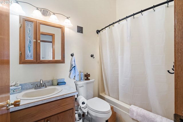 full bathroom with shower / tub combo, vanity, and toilet