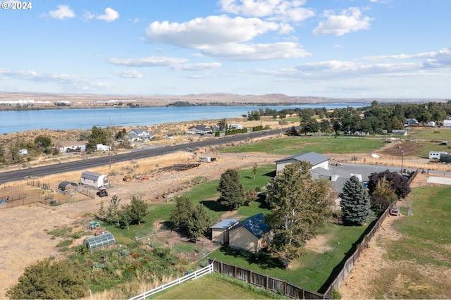 bird's eye view with a water view and a rural view