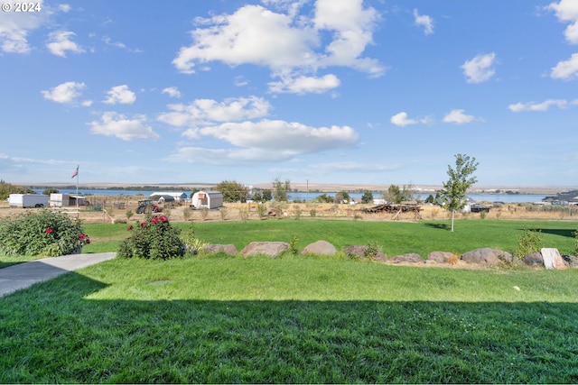 view of yard with a water view