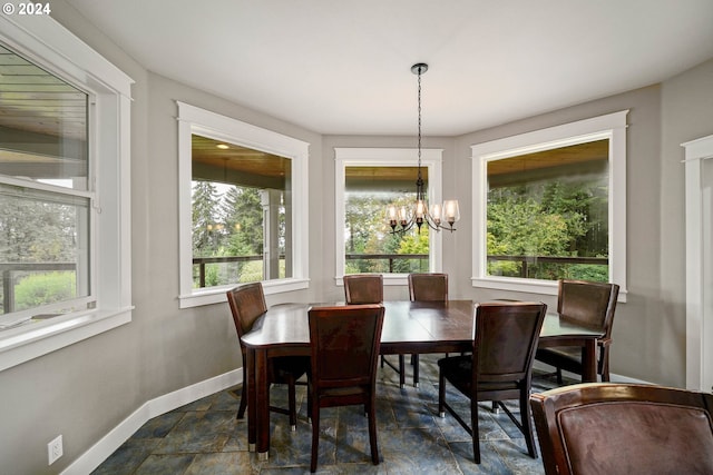 dining space with a chandelier and a healthy amount of sunlight