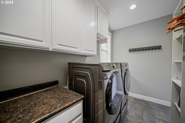 laundry area featuring cabinets and independent washer and dryer