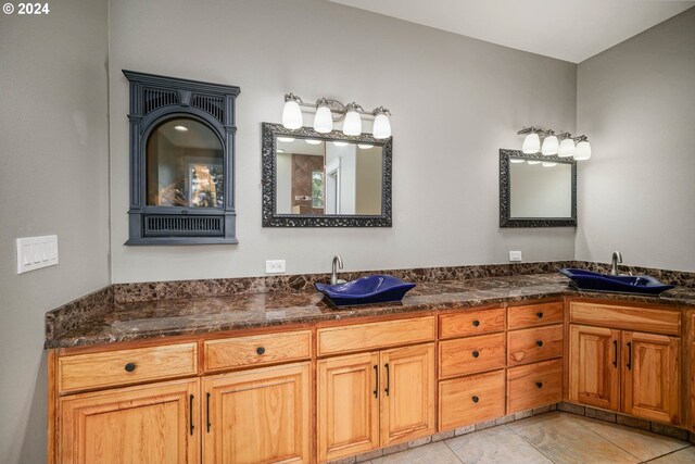 bathroom featuring tile patterned floors and vanity