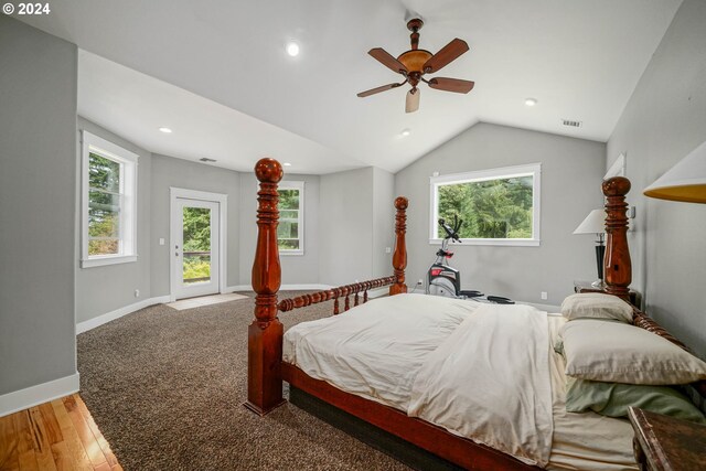 bedroom with ceiling fan, access to exterior, wood-type flooring, and vaulted ceiling