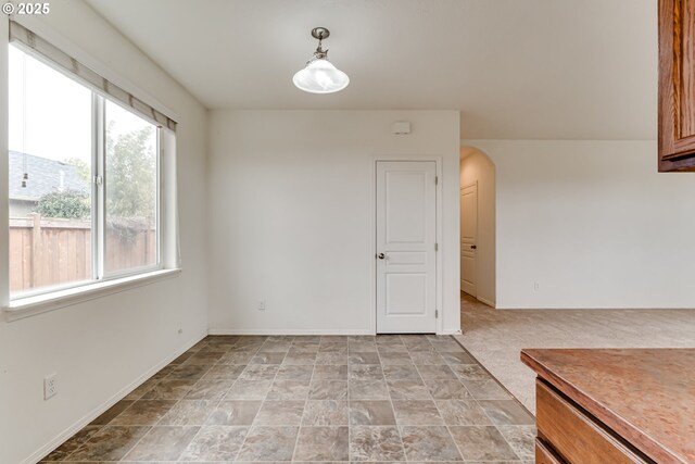 bedroom featuring dark colored carpet, a textured ceiling, and a closet