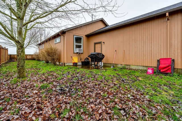 view of side of home with cooling unit