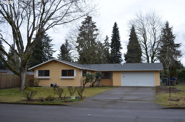 single story home featuring a front yard and a garage