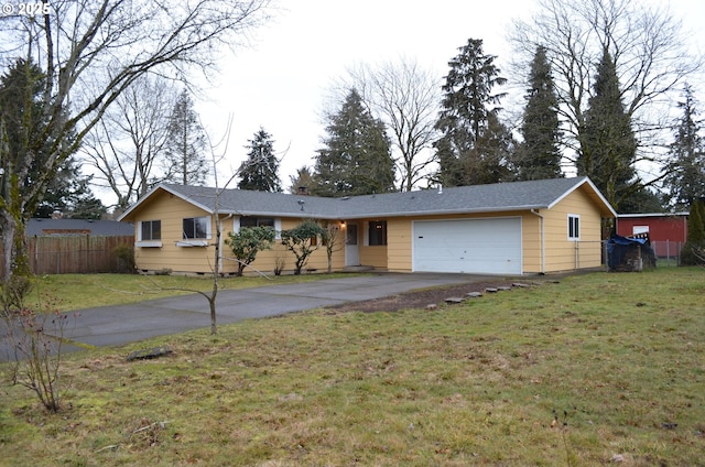 ranch-style home featuring a front lawn and a garage