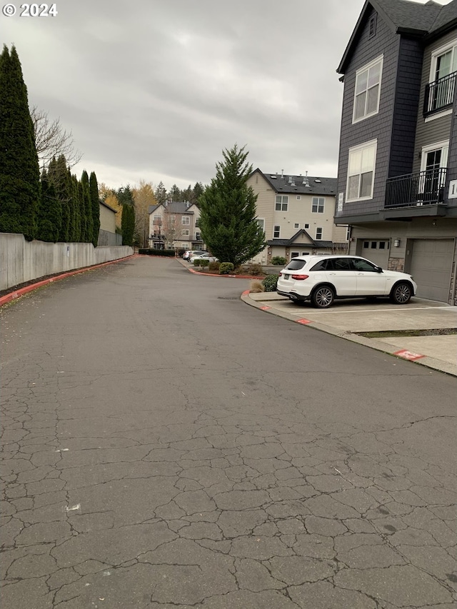 10733 NE Red Wing Way Unit 101, Hillsboro, OR 97006 - view of asphalt street with curbs and a residential view