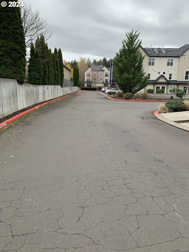 10733 NE Red Wing Way Unit 101, Hillsboro, OR 97006 - view of asphalt road featuring curbs and a residential view