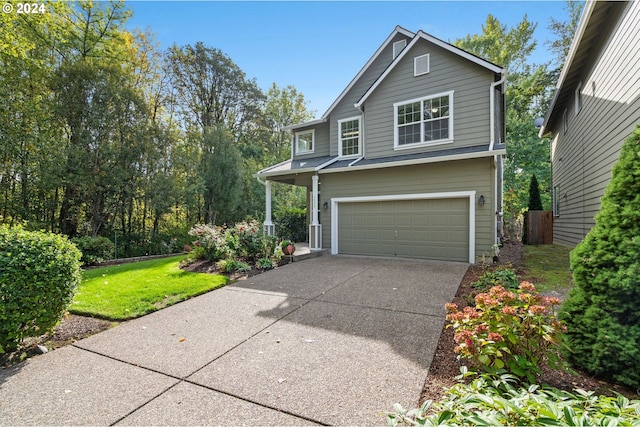 view of front facade featuring a front yard and a garage