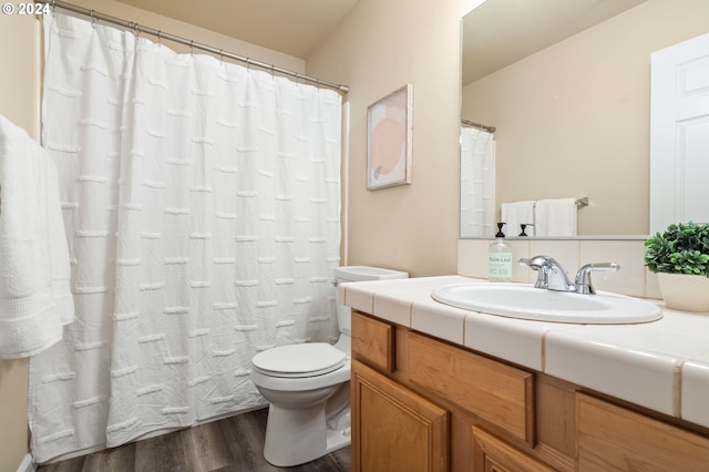 bathroom featuring hardwood / wood-style floors, vanity, and toilet