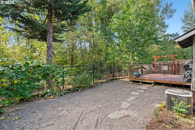 view of patio featuring a wooden deck and cooling unit