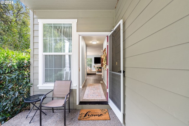 property entrance with a patio area