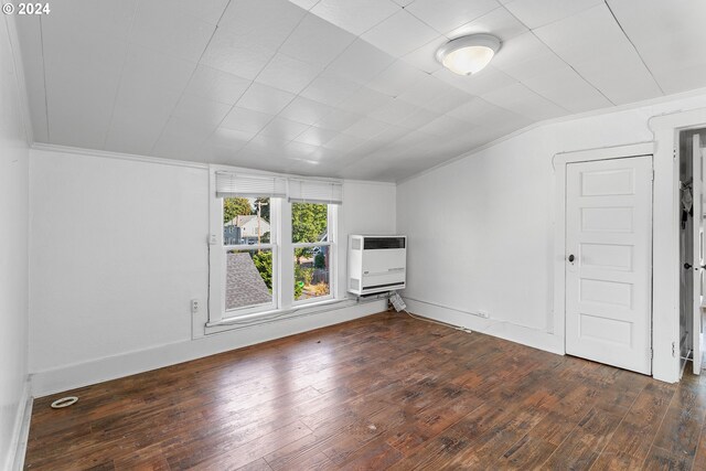 bonus room with heating unit, lofted ceiling, and dark hardwood / wood-style floors