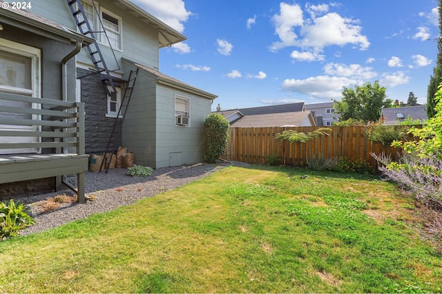 view of yard with cooling unit and a wooden deck