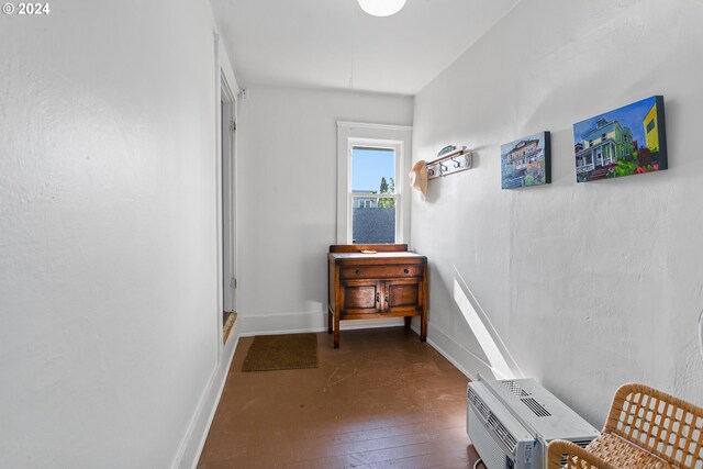 hallway with dark hardwood / wood-style flooring