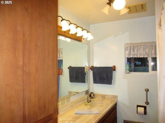 bathroom with vanity and ceiling fan