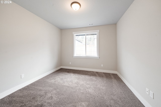 unfurnished room with carpet floors