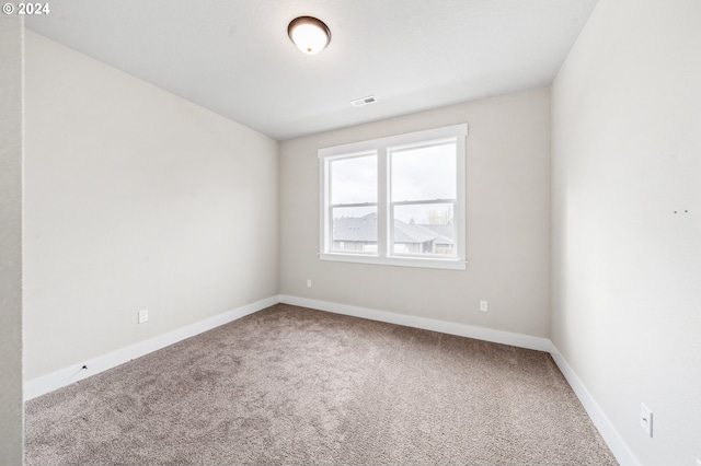 empty room featuring carpet flooring