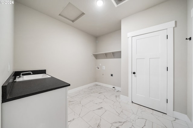 laundry area with hookup for an electric dryer, washer hookup, and sink