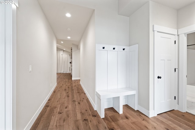 mudroom with light hardwood / wood-style flooring