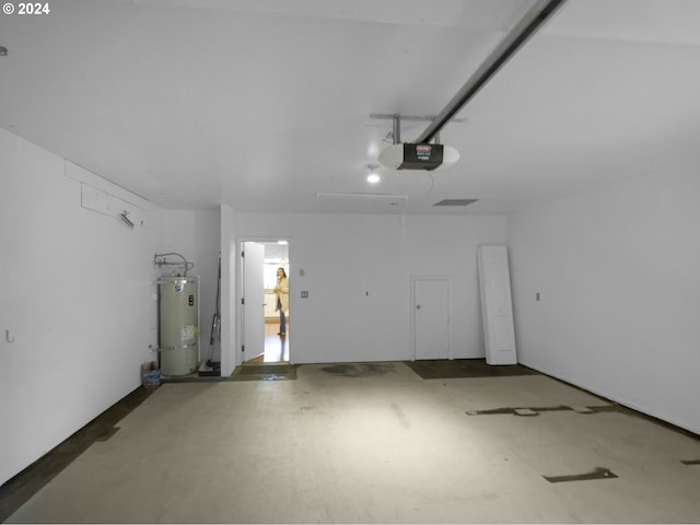 1735 Arch Ln, Brookings, OR 97415 - garage featuring water heater and a garage door opener