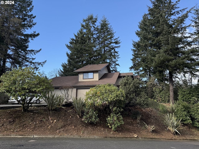 1735 Arch Ln, Brookings, OR 97415 - view of property hidden behind natural elements featuring an attached garage