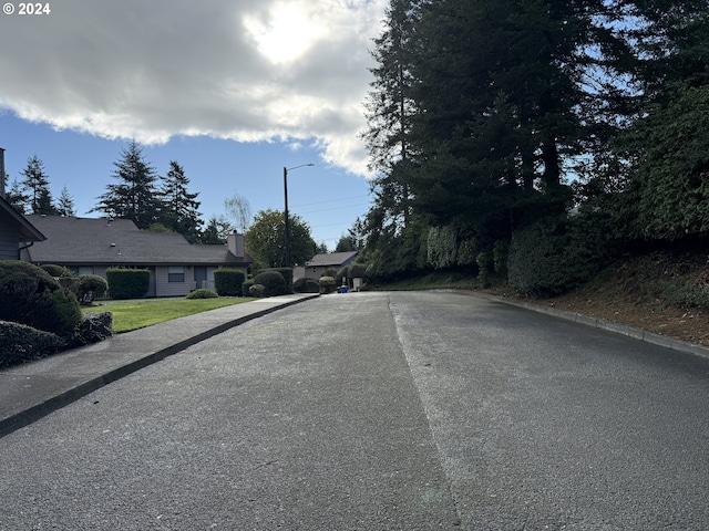 1735 Arch Ln, Brookings, OR 97415 - view of asphalt road featuring street lighting