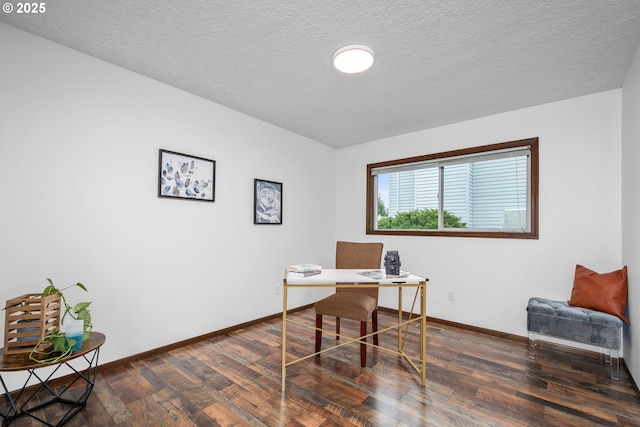 office featuring wood finished floors, baseboards, and a textured ceiling