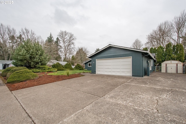 garage featuring concrete driveway