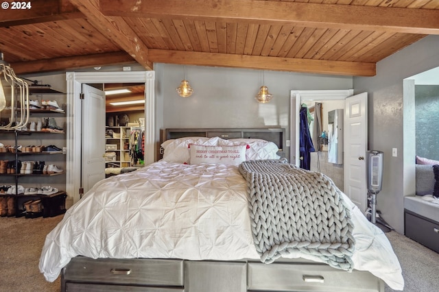 carpeted bedroom with beamed ceiling and wood ceiling