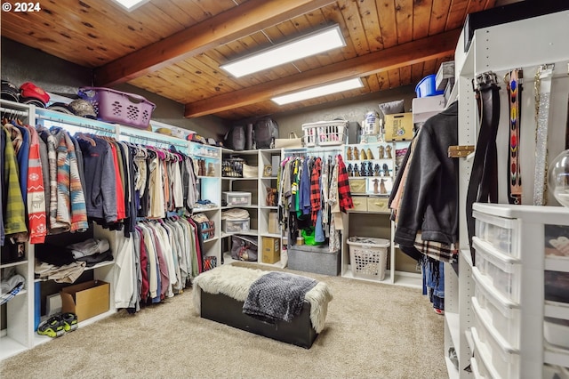 spacious closet with carpet and beamed ceiling