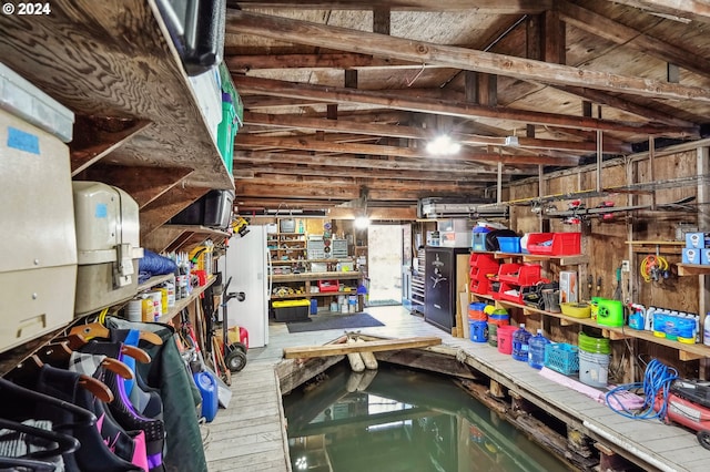 interior space featuring vaulted ceiling with beams and a pool