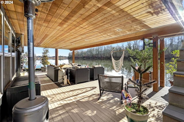 wooden deck with a water view