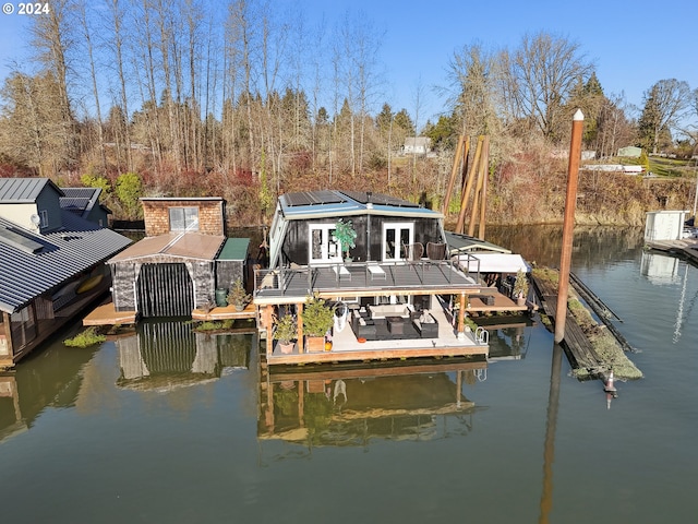 view of dock featuring a deck with water view