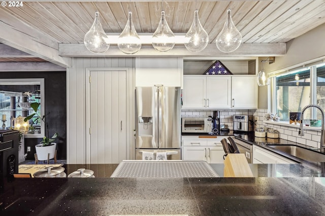 kitchen featuring sink, white cabinetry, stainless steel refrigerator with ice dispenser, and wood ceiling