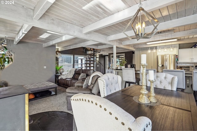 dining area with beamed ceiling and an inviting chandelier