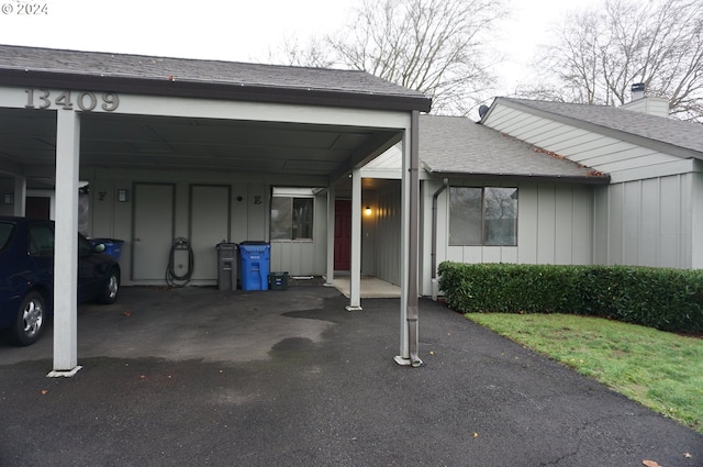 exterior space with a carport