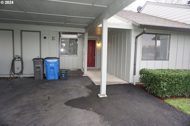 view of exterior entry with a carport